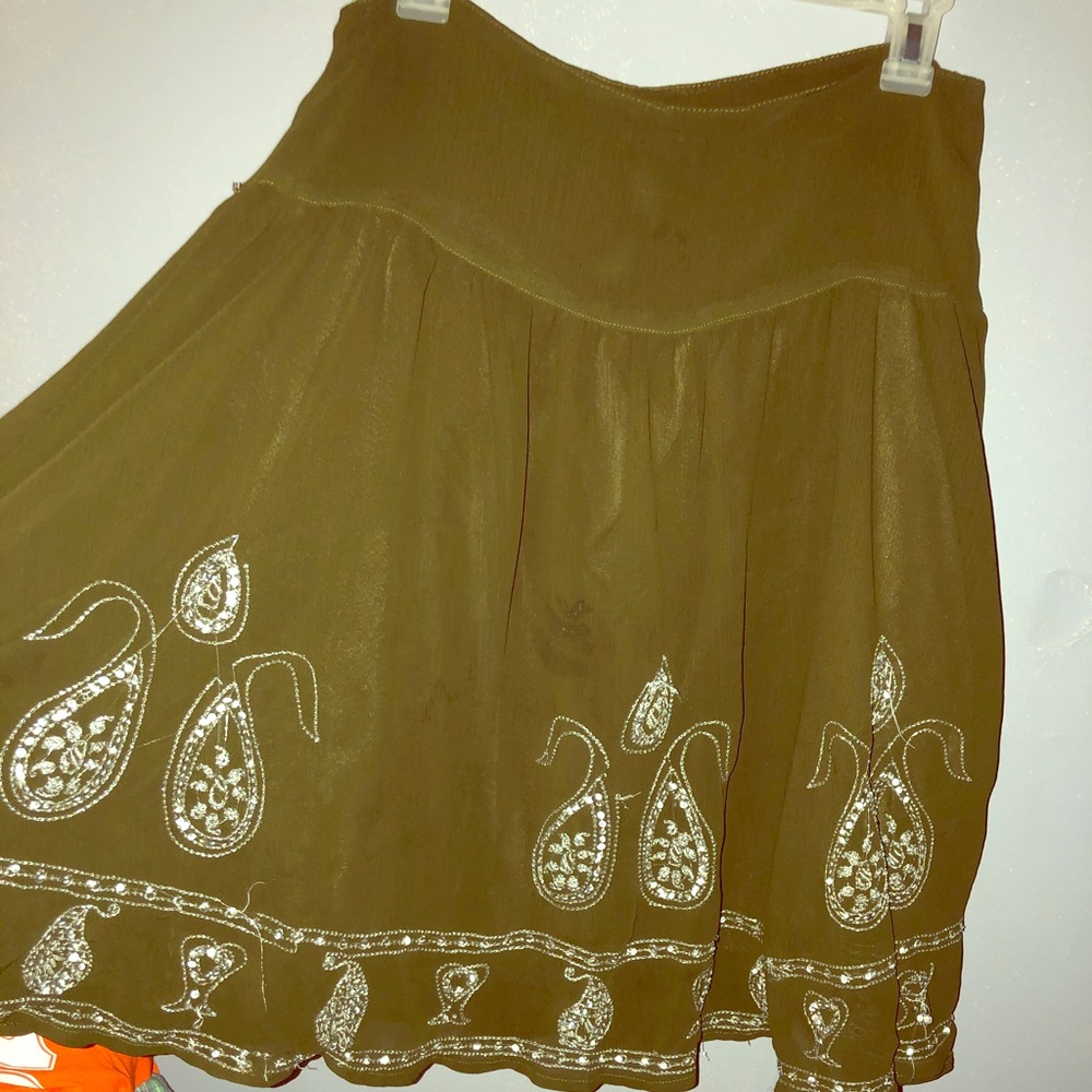 Knee length army green embroidered skirt.